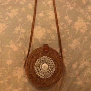 Shell embroidered woven purse.